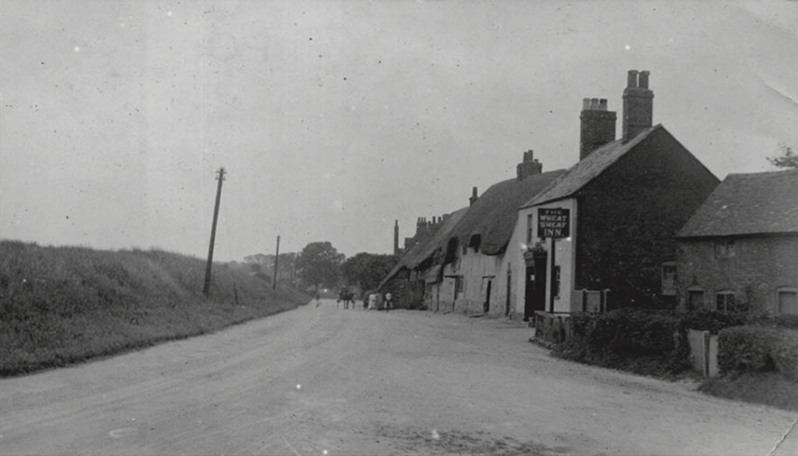 Historic view of The Wheatsheaf and village street