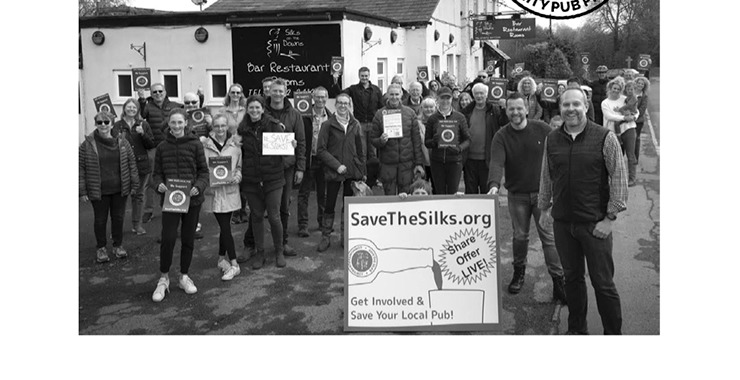 Community campaigners outside Silks on the Downs