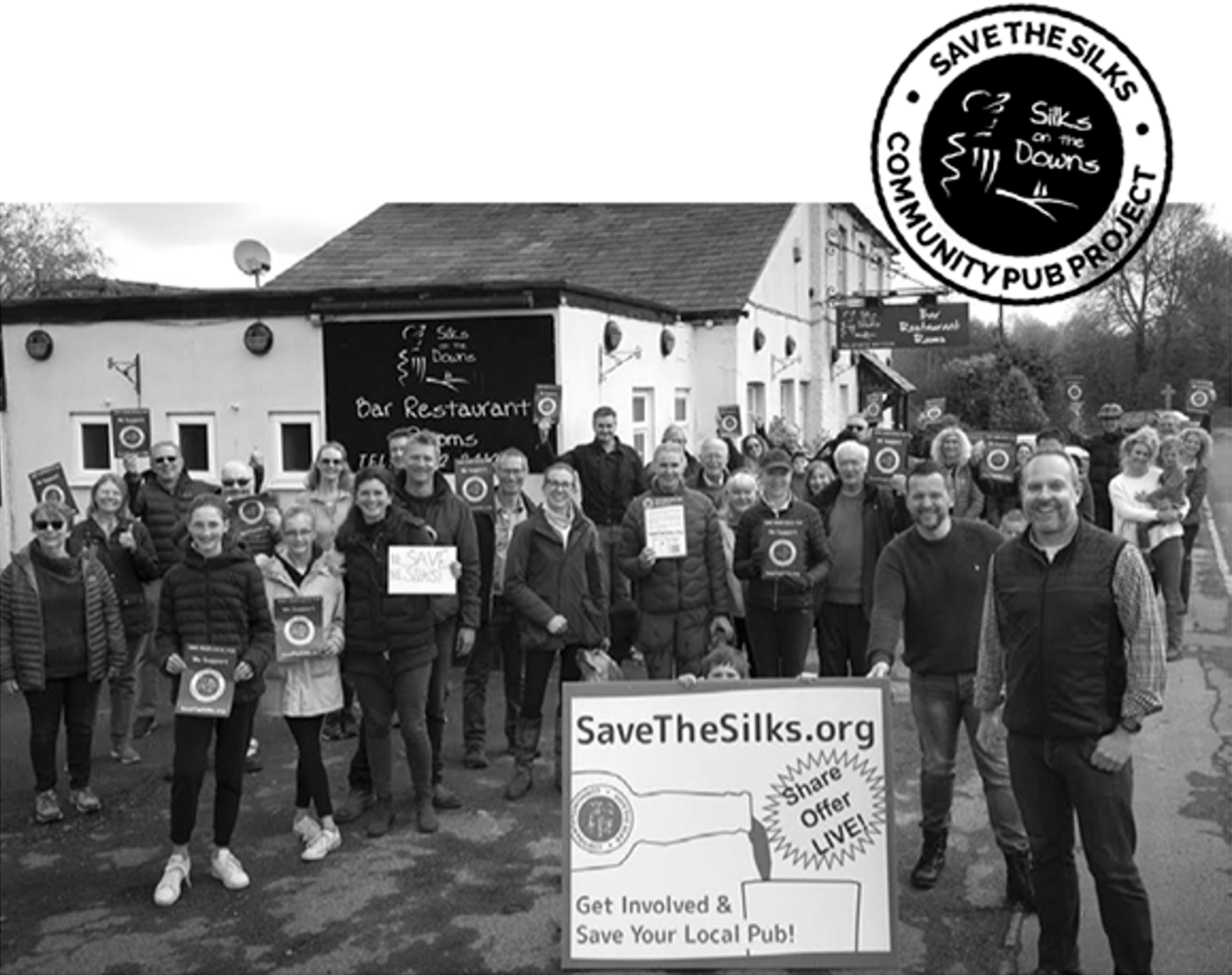 Community campaigners outside Silks on the Downs